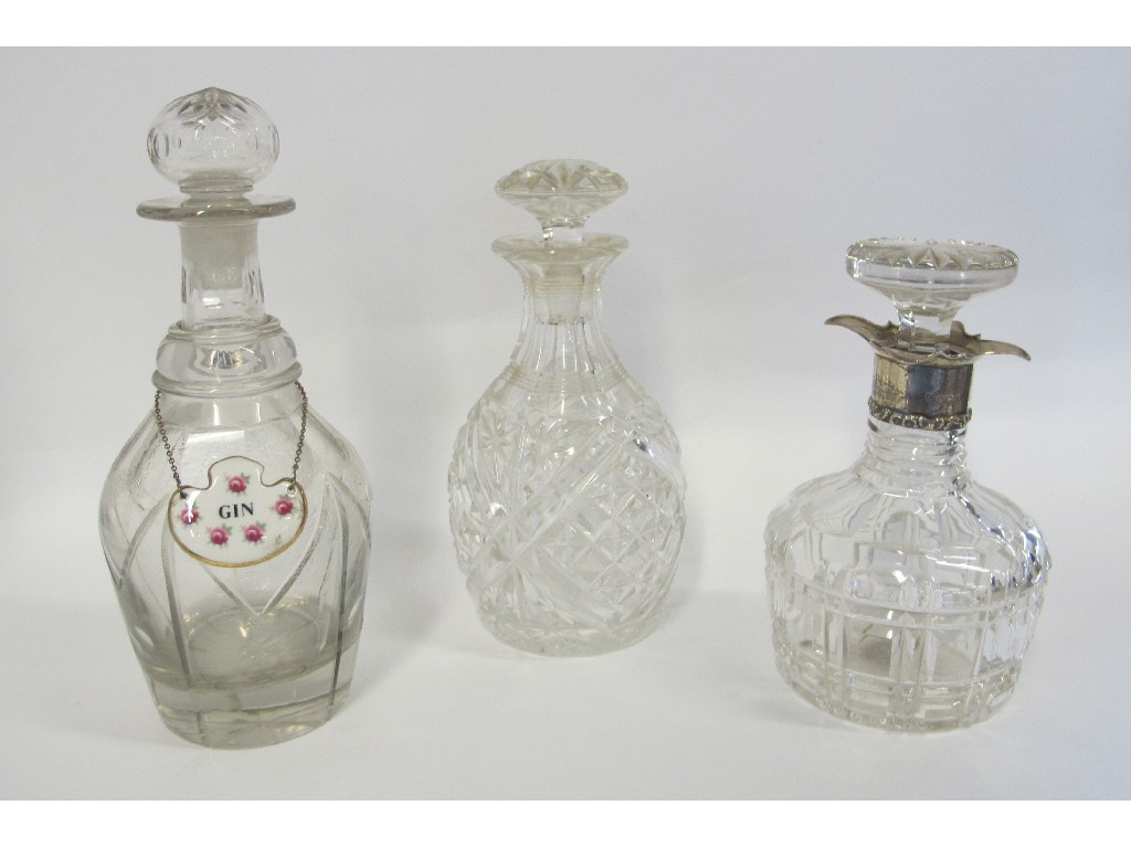 Appraisal: Three cut glass decanters one with silver collar