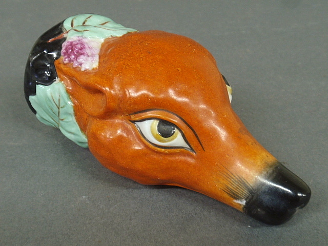 Appraisal: - Porcelain fox head stirrup cup c h x w