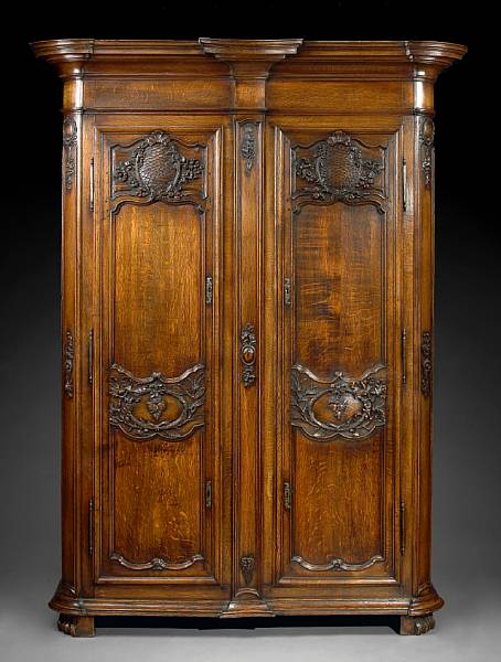 Appraisal: A Louis XV style carved oak armoire second half th