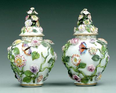 Appraisal: Pair lidded porcelain jars encrusted with flowers leaves and vines