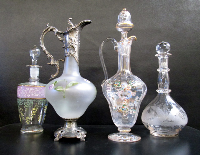 Appraisal: FOUR VICTORIAN GLASS BOTTLES AND EWER of various forms and