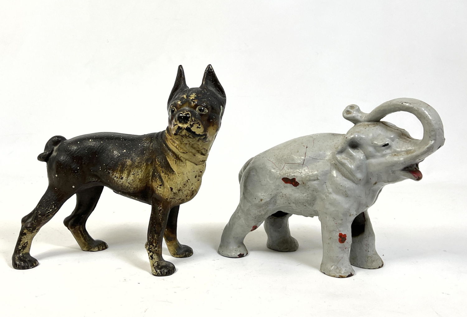 Appraisal: Vintage Cast Iron Dog and Elephant door stops Dimensions H