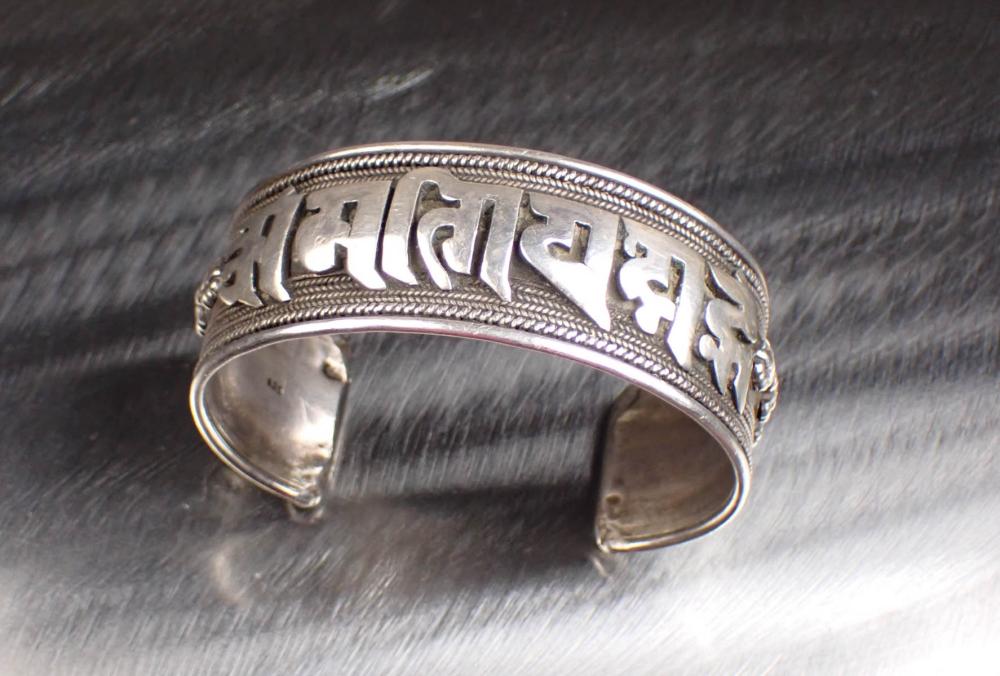 Appraisal: STERLING SILVER NEPALI MANTRA CUFF BRACELET The hand-carved adjustable sterling