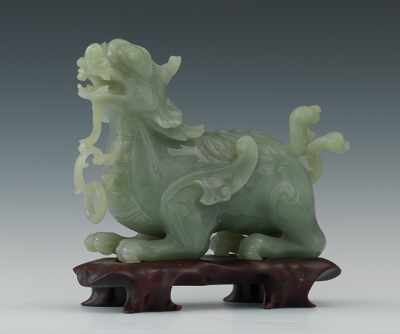 Appraisal: A Carved Celadon Green Jade Dragon Gracefully carved and polished