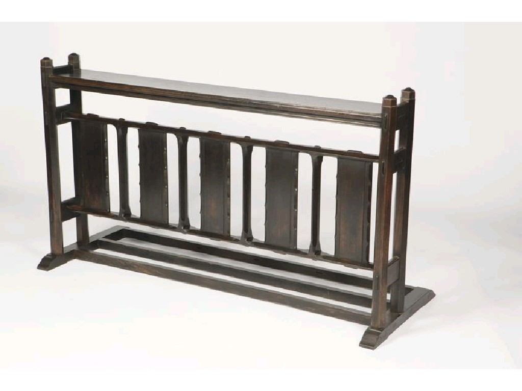 Appraisal: SIDNEY BARNSLEY A STAINED OAK KNEELING RAIL with a rectangular