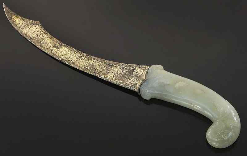 Appraisal: Mughal jade carved sword handle with a French blade Jade