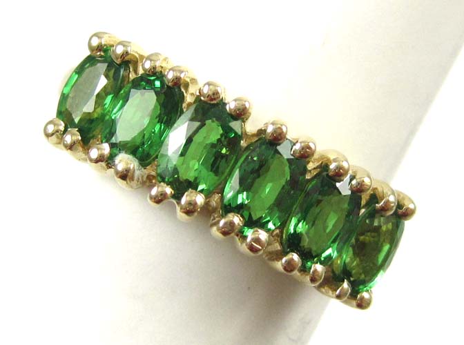 Appraisal: TSAVORITE GARNET AND FOURTEEN KARAT GOLD RING set with six