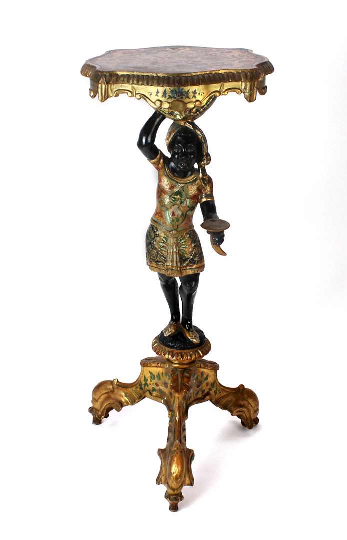 Appraisal: A Venetian polychrome decorated blackamoor torchere on tripod base cm