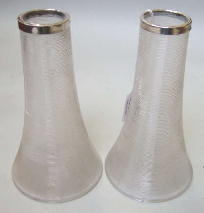 Appraisal: A pair of ribbed glass and silver mounted spill vases