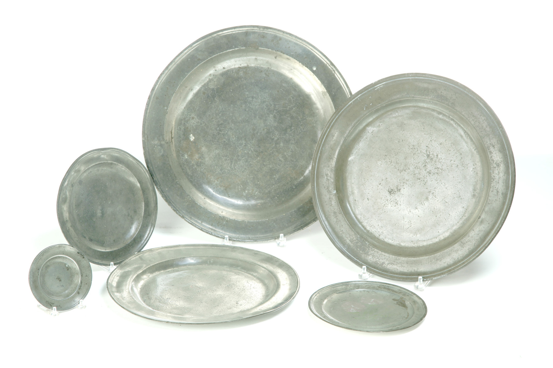 Appraisal: SIX EUROPEAN PEWTER CHARGERS AND PLATES Nineteenth century Three chargers