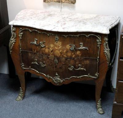 Appraisal: A Continental marquetry inlaid commode of bombe shape with veined