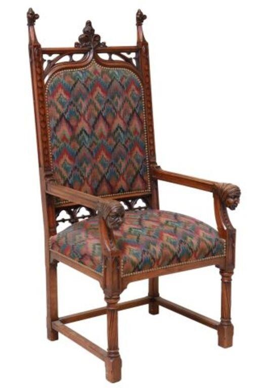 Appraisal: FRENCH GOTHIC REVIVAL UPHOLSTERED WALNUT ARMCHAIRFrench Gothic Revival carved walnut