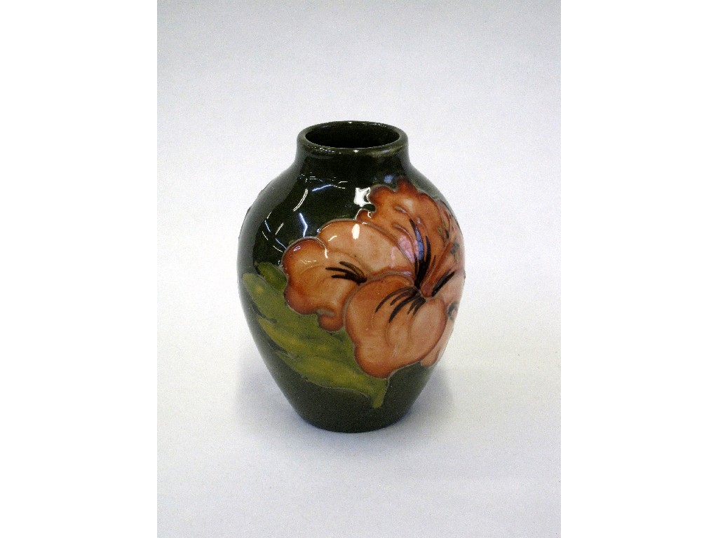 Appraisal: Small Moorcroft Hibiscus pattern vase on green ground high