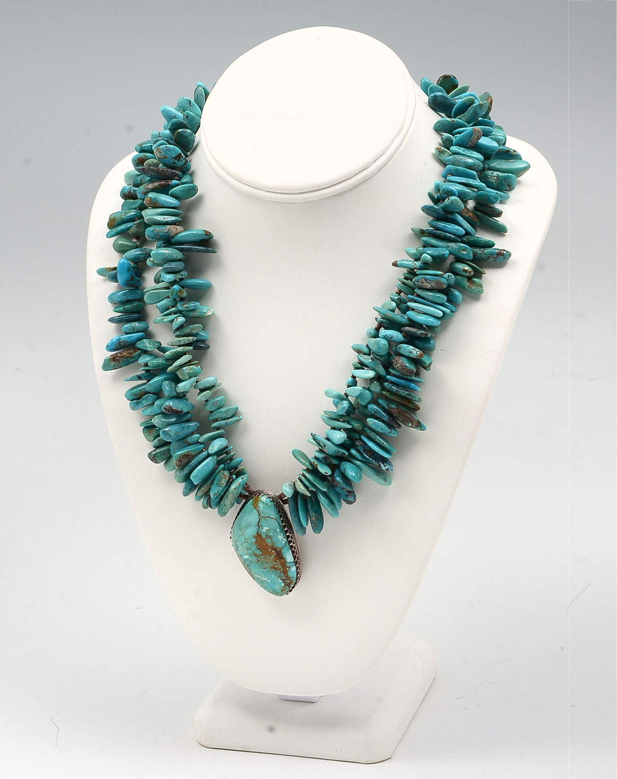 Appraisal: MASSI ORIZ TURQUOISE SILVER NECKLACE Lush strands of irregular shaped