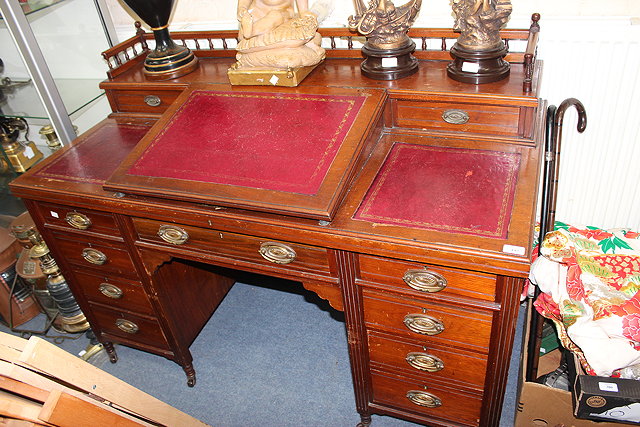 Appraisal: A VICTORIAN WALNUT DICKENS TYPE PEDESTAL DESK the galleried top