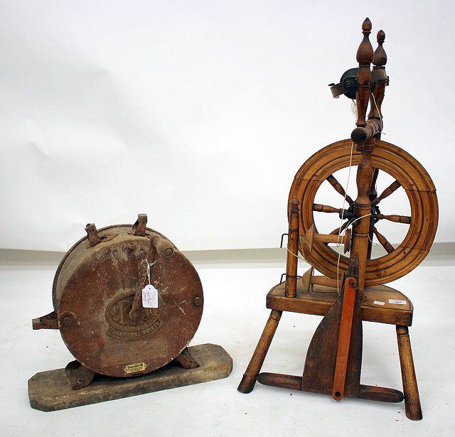 Appraisal: A TH CENTURY SPINNING WHEEL cm wide together with a