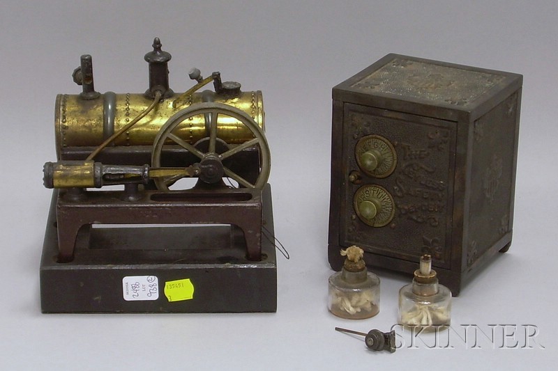 Appraisal: Steam Engine and Toy Bank toy safe by the Keyless