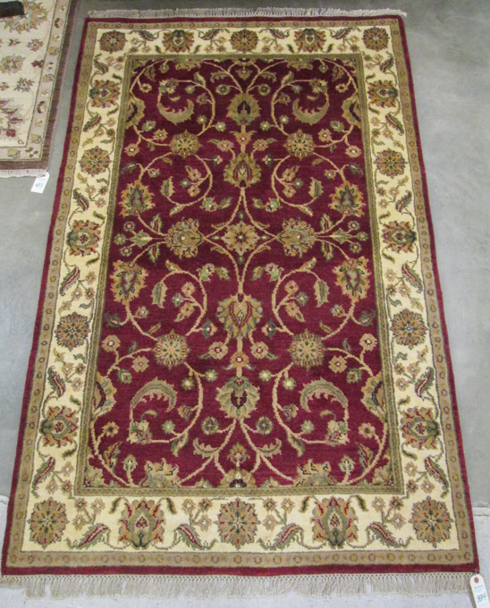 Appraisal: HAND KNOTTED ORIENTAL AREA RUG Indo-Persian scrolling floral raceme decoration