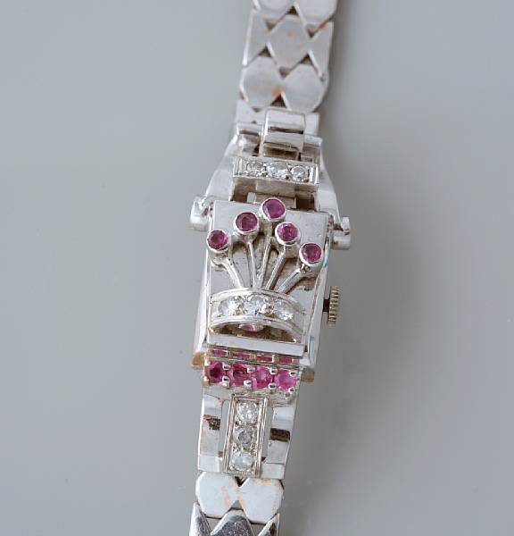 Appraisal: A ruby and diamond covered-dial bracelet watch jewel Swiss movement