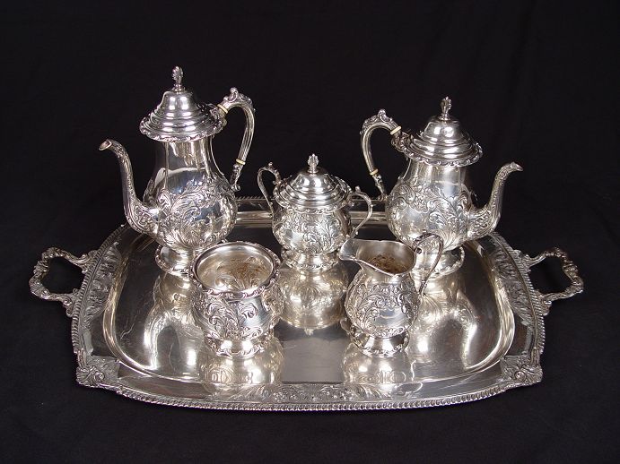 Appraisal: PIECE HAND CHASED STERLING TEA SERVICE Unascribed American hallmark hand