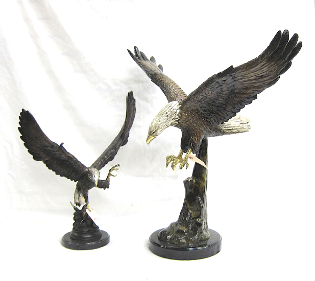 Appraisal: TWO BRONZE EAGLE SCULPTURES each cast with silver-gilded head and