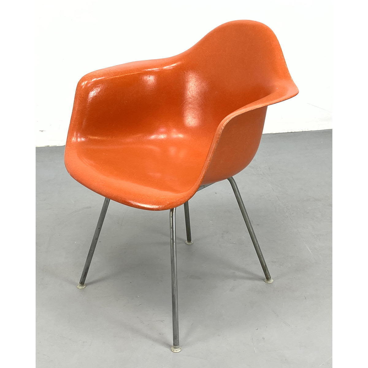 Appraisal: CHARLES EAMES Orange Fiberglass Shell Lounge Chair Rolled Arms Metal