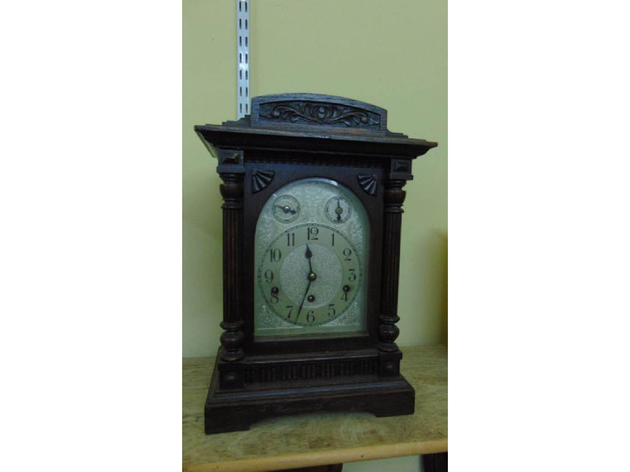 Appraisal: An Edwardian oak bracket clock the case with turned and