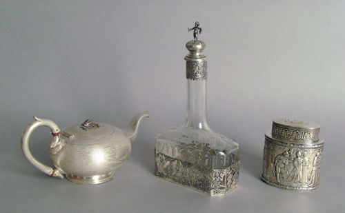 Appraisal: German sterling silver mounted decanter h together with a tea