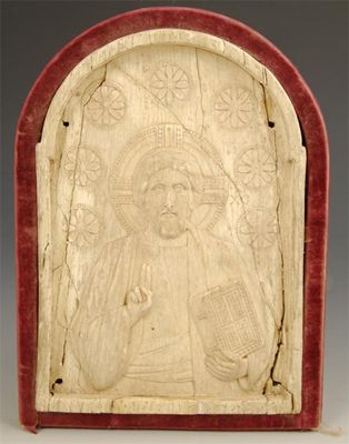 Appraisal: A carved relief arched plaque depicting an apostle possibly St