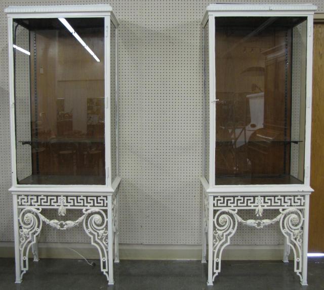 Appraisal: Pair of Ornate Cast Iron Display Cabinets with decorative legs