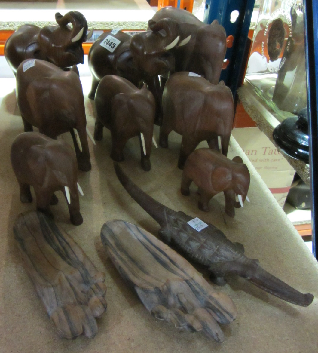 Appraisal: A quantity of hardwood carved elephants a crocodile and a