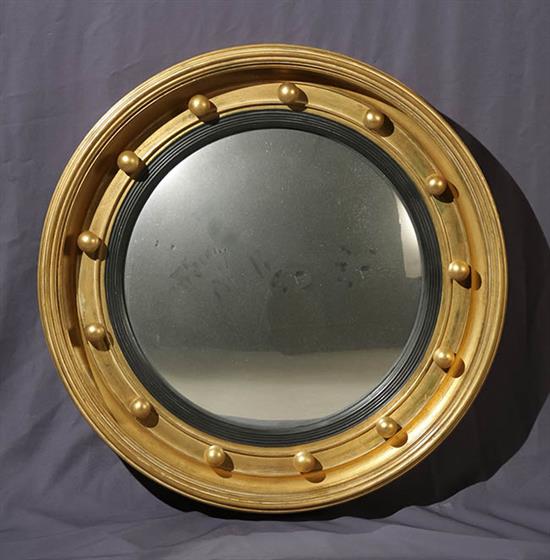 Appraisal: Pair of Regency Style Parcel Ebonized Giltwood Convex Mirrors Carver's