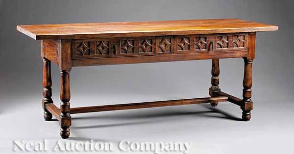 Appraisal: An Italian Renaissance-Style Walnut Refectory Table plank top two carved