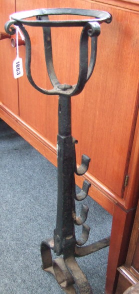 Appraisal: A pair of English wrought iron andirons th century with