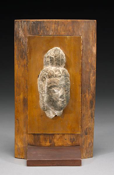 Appraisal: A carved grey stone fragment of the head of a