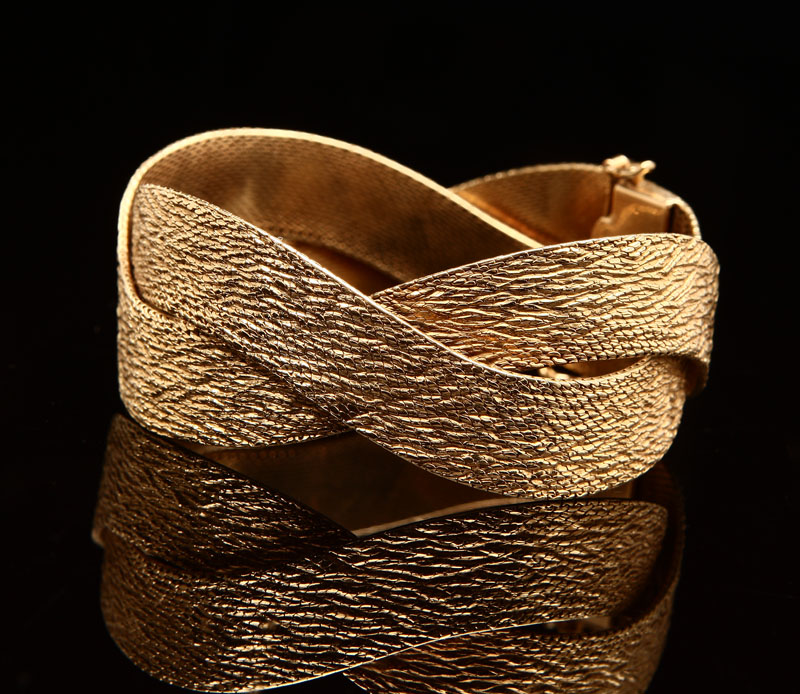 Appraisal: An K yellow gold woven bracelet Of textured K yellow