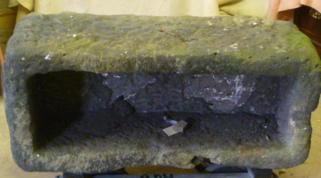 Appraisal: A GRITSTONE GARDEN TROUGH of rough hewn oblong form x