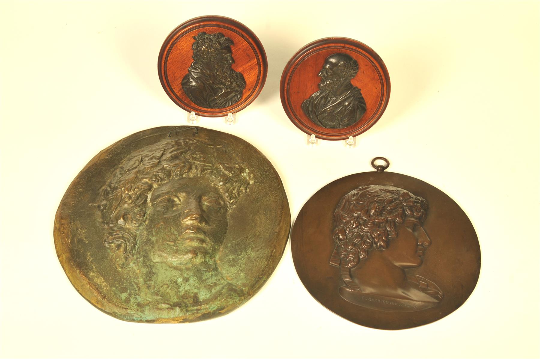 Appraisal: FOUR BRONZE PLAQUES WITH CLASSICAL BUSTS European st quarter- th