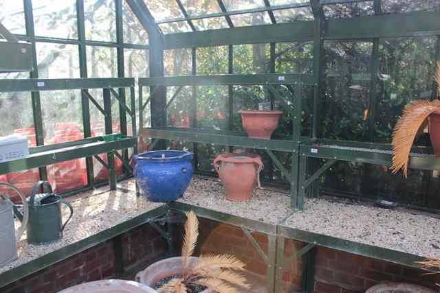 Appraisal: A SET OF FOUR THREE TIER GREEN PAINTED GREENHOUSE SHELVING