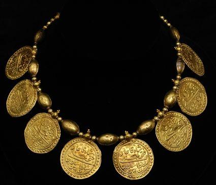 Appraisal: Gold Necklace with Beads and Islamic Disk Pendants