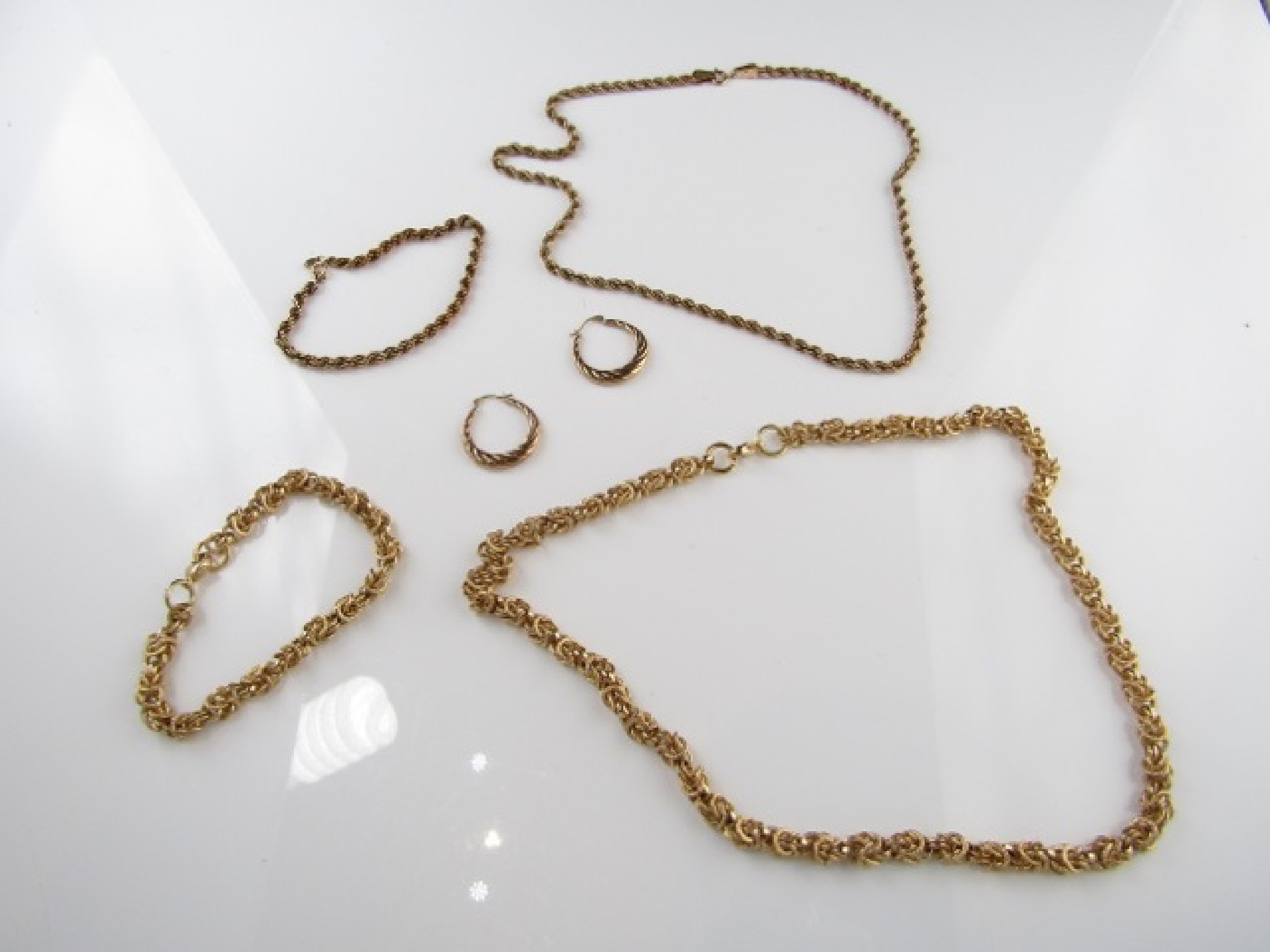 Appraisal: A ct gold rope-twist necklace with matching bracelet g in