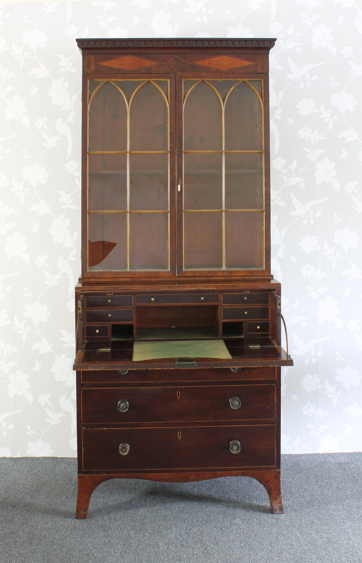 Appraisal: A Regency mahogany and inlaid secretaire bookcase the dentil cornice