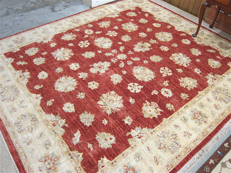 Appraisal: HAND KNOTTED ORIENTAL CARPET Pakistani-Persian overall floral arabesque decoration on