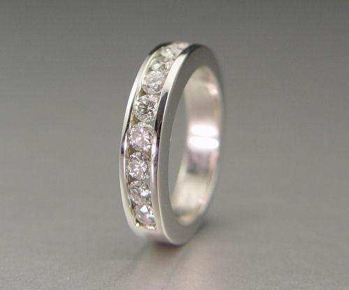 Appraisal: PLATINUM STONE DIAMOND WEDDING BAND Platinum brand contains ten round