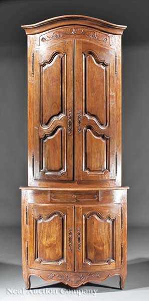 Appraisal: A French Provincial Carved Walnut Encoignure Deux Corps th c