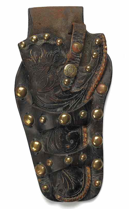 Appraisal: Leather tooled holster with a brass bead decoration and button