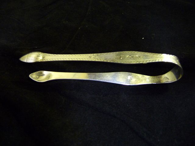 Appraisal: Sterling silver sugar tongs with a very rare mark by