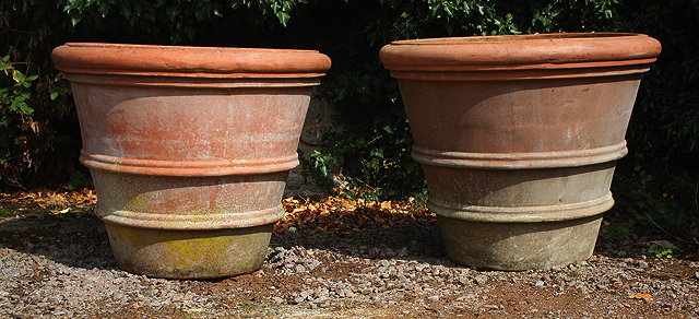 Appraisal: A PAIR OF EXCEPTIONALLY LARGE TERRACOTTA GARDEN PLANTERS each marked