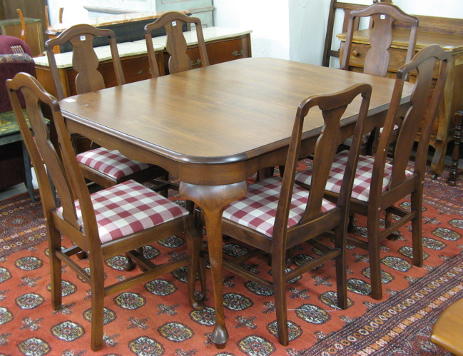 Appraisal: QUEEN ANNE STYLE WALNUT DINING TABLE AND CHAIR SET American