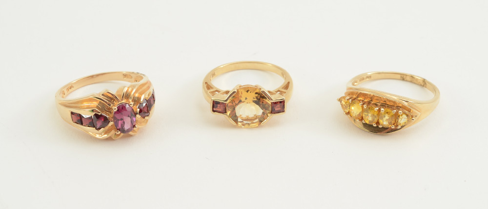 Appraisal: TRIO OF k GOLD GARNET AND CITRINE RINGS GARNET RING